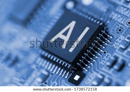 Close- up of computer chip with AI sign. Artificial intelligence.