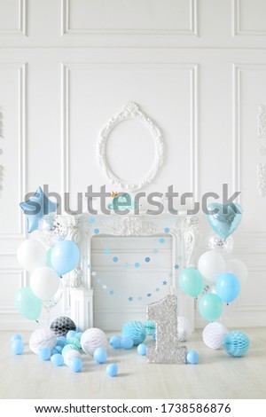 Decorations for holiday party. A lot of balloons blue and white colors.