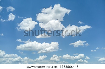 White clouds against the blue sky. Template for wallpaper, stretch ceilings