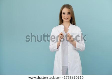 Positive emotions doctor woman on a blue background