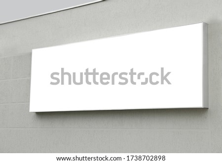 Blank lightbox poster on wall outdoors. Advertising board design