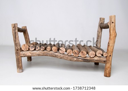 Small wooden bed used in newborn photography