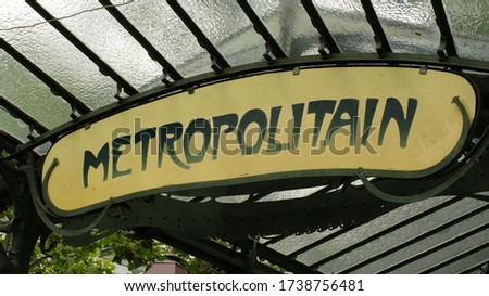 Parisian metro entrance and the sign