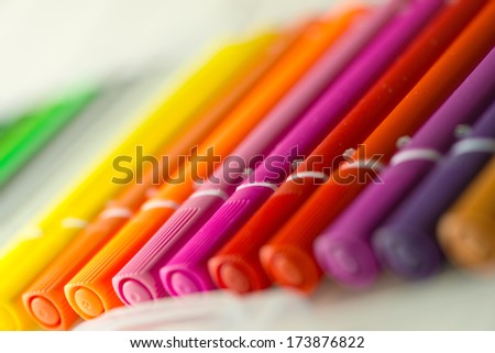 a row of coloring markers