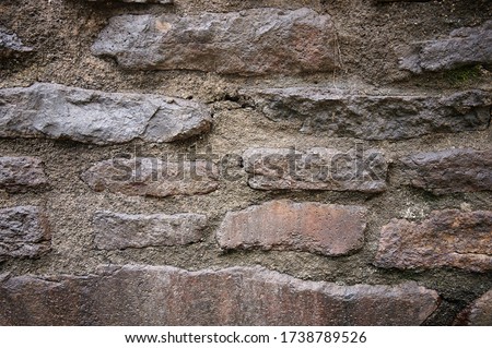 Close up of stone wall with cement. Texture of stonewall Royalty-Free Stock Photo #1738789526