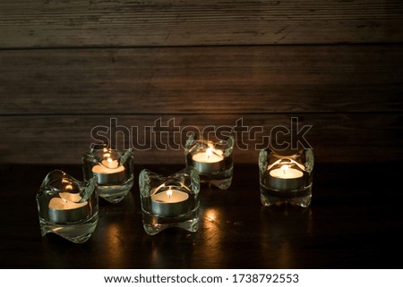 
Light a candle in a glass of brightness at night