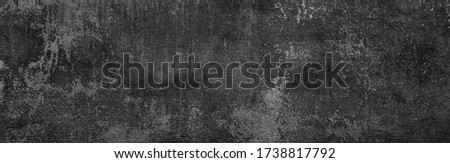 Shattered plaster on cement painted wall. Flaked exterior city facade. Coarse grunge, worn blocks background. Uneven surface of loft stone structure. Retro dark sandstone texture for 3d design scene