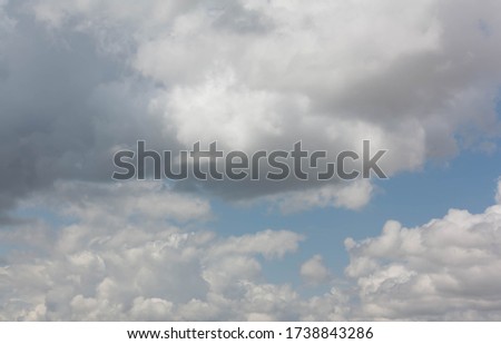 Blue sky with many slightly dark clouds for backgrounds