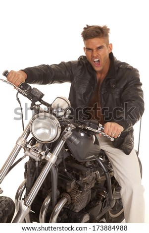 A man with a funny expression sitting on his motorcycle.