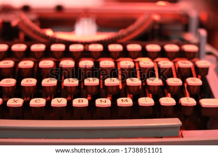 Vintage typewriter under red light