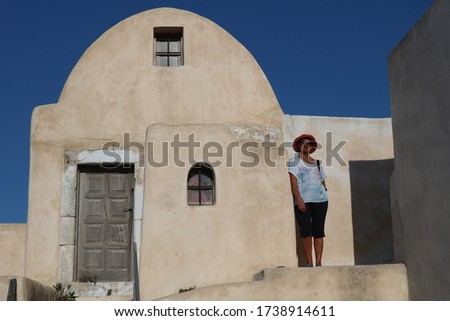 Adult woman visit Pirgos, Santorini island