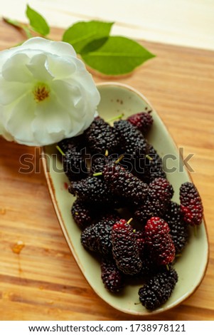 delicious, organic, healthy blackberries in a white semaic bowl