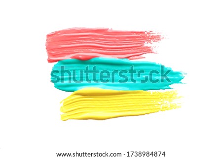 three strokes of red, blue and yellow thick acrylic paint. place for text. isolate on a white background.
 Royalty-Free Stock Photo #1738984874