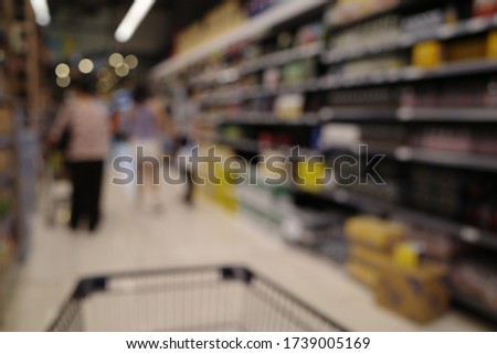 Blur abstract background of people shopping in super market ,products on shelves ,Supermarket with bokeh,customer defocus