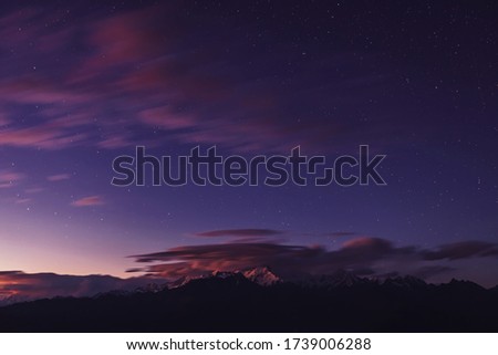Milky Way over the mountains of the Himalayas. Night landscape with the bright galaxy in Langtang National Park on the altitude 3900 meters in Nepal