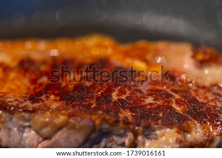 Pictures  of a sliced fresh rump steak with fat on the steak in a pan, which the steak cooks through in high heat