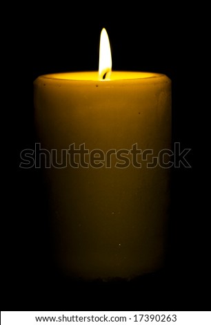 Candle isolated on black background