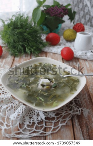 Green borsch of sorrel, vegetables, eggs with meat