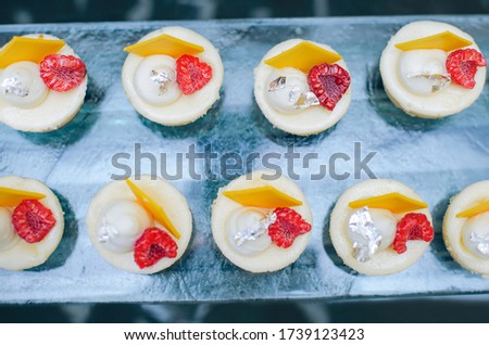 Cakes with raspberries and lemon chocolate at a Baby Shower. 
Holiday Catering