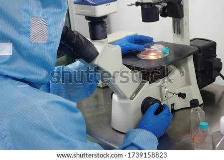 Scientists are conducting clinical trials of a new coronavirus vaccine in biological laboratories and conducting biochemical analyses to see if cells produce antibodies and immune responses. Royalty-Free Stock Photo #1739158823