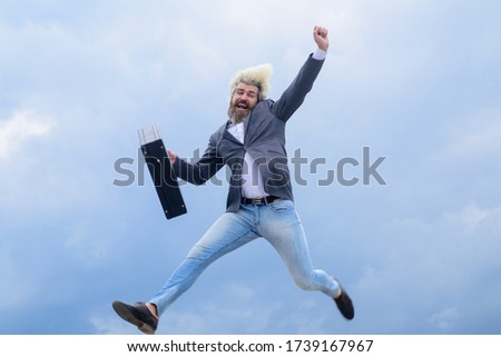Excited businessman. Advertising. Businessman running with suitcase. 