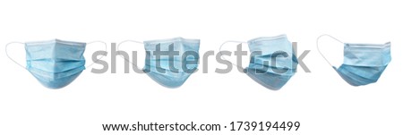 Medical face mask isolated on white background with clipping path around the face mask and the ear rope. Concept of COVID-19 or Coronavirus Disease 2019 prevention by wearing face mask. Royalty-Free Stock Photo #1739194499