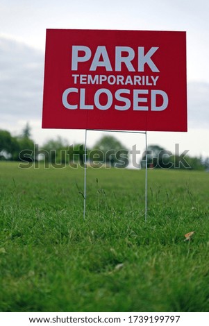 park temporarily closed red table sign on nature background 