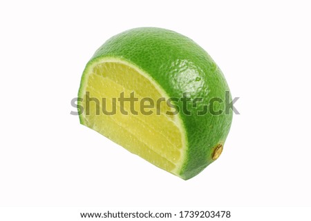    Ripe slice of green lime citrus fruit stand isolated on white background.                            
