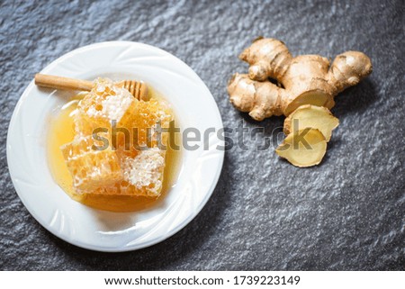 Honey ginger on plate background 