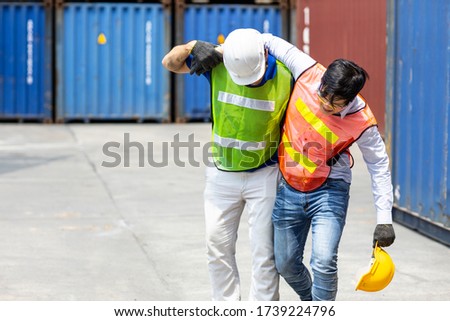 worker leg injured or faint from stress and hard working, a friend support help to walk to first aid. Royalty-Free Stock Photo #1739224796