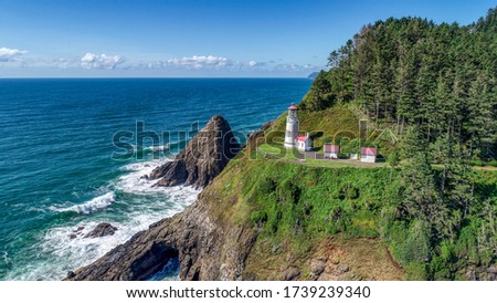 Aerial view of Heceta Head Lighthouse near Florence, Oregon. Royalty-Free Stock Photo #1739239340