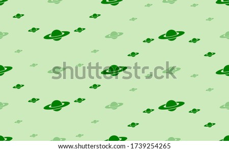 Seamless pattern of large and small green saturn symbols. The elements are arranged in a wavy. Vector illustration on light green background