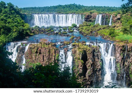 Iguazu Falls, Brazilian side. View of the waterfalls among the greenery of the jungle and rocks.