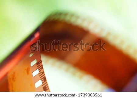 Color negative film in blur. 35mm negative film. Photographic film view with shallow depth of field.