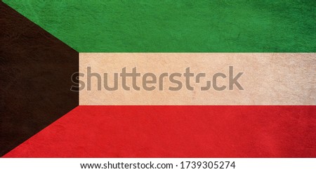Kuwait flag printed on leather. Vintage effect, grunge style, top view. ideal for Kuwait state patriotism