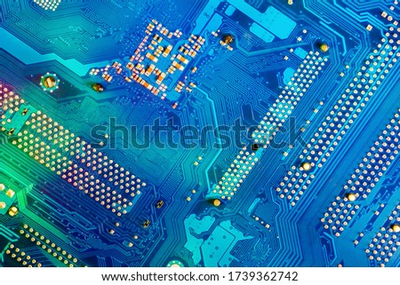 Blue electronic circuit board background, close up