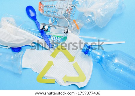 Plastic waste collection on blue background. Concept of Recycling plastic and ecology. Flat lay, top view