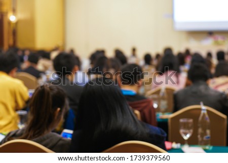 Blurred background of business people sitting in conference hall meeting seminar room, Business education concept