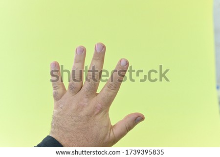 Nails Design. Hand With Colorful Nails On Yellow,green,pink Background. Close Up Of Female Hands With Beauty Bright Geometric Manicure And Background. High Quality Image.