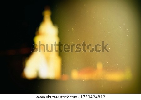 Scenery of Blurred Church from Dirty Scratched Glass Window at Night Background, Suitable for Religion Poster and Book Cover.