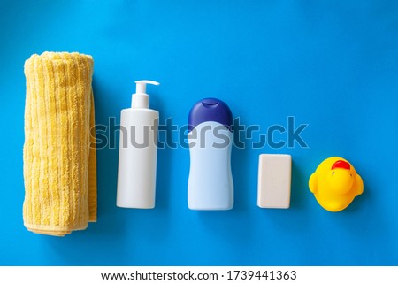 baby bath products, baby care, Yellow rubber duck for bath games. Soap bubbles, bath foam, soap bubbles.