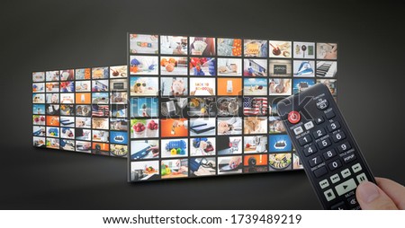 Television streaming, TV multimedia panel. Hand with remote control