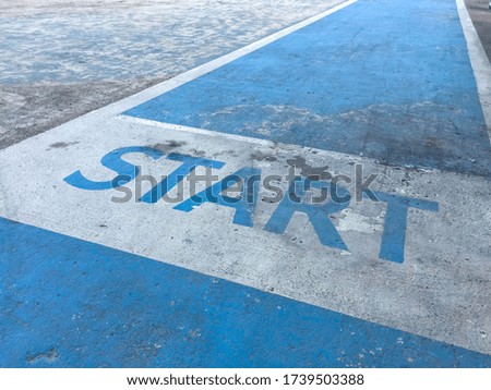 The word 'start' on the jogging track