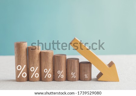 Wooden blocks with percentage sign and down arrow, investment reduce, financial recession crisis, interest rate decline, risk management concept Royalty-Free Stock Photo #1739529080