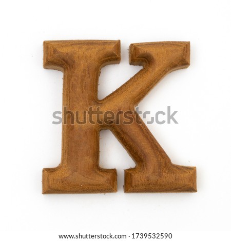 wooden letters K english alphabet on white background