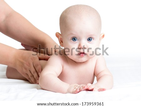 masseur massaging baby girl