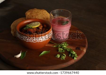 Maharashtrian Spicy Cuisine. Malvani special dish kombadi wade, Chicken-wade Royalty-Free Stock Photo #1739667440