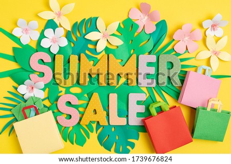 Word Sale over tropical paper cut leaves background. Summer sale, online deals, discounts concept.