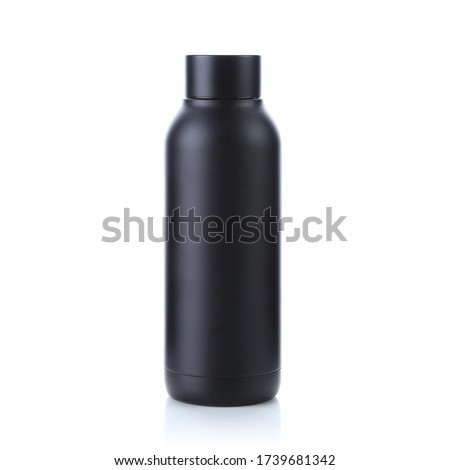Blank black trendy closed travel flask. Empty traveler bottle & drink container template isolated on white background. Thermo mug for hot or cold beverage, water, tea & coffee. For mockup & branding. Royalty-Free Stock Photo #1739681342