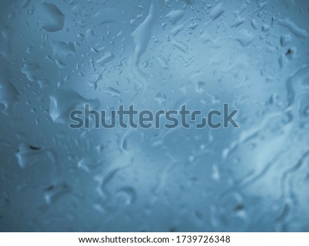 Water droplets that perch on the glass.